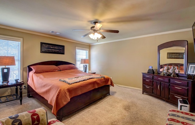 bedroom with visible vents, light carpet, baseboards, and ornamental molding