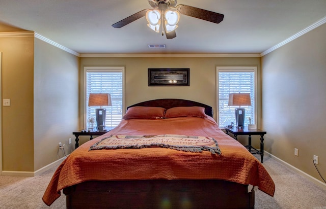 carpeted bedroom with visible vents, multiple windows, and ornamental molding