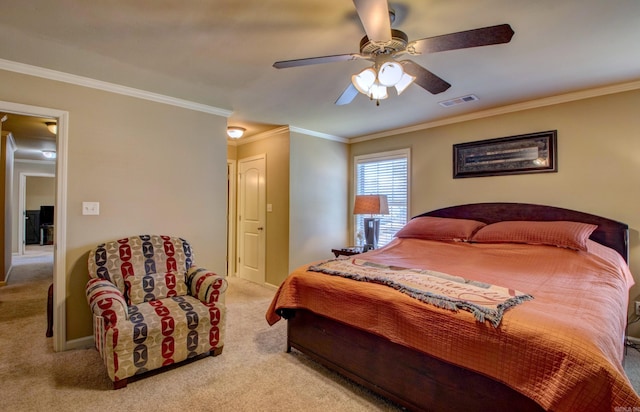 carpeted bedroom with visible vents, baseboards, a ceiling fan, and crown molding