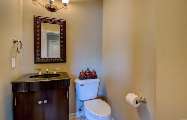 bathroom featuring toilet and vanity