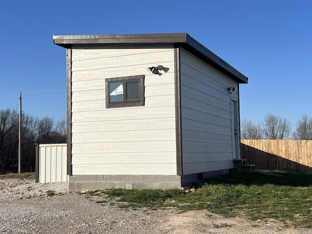 view of outdoor structure featuring fence