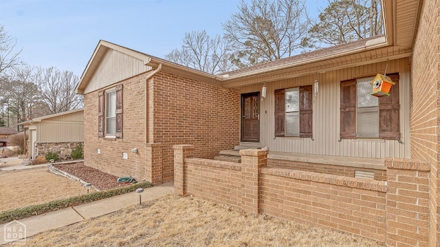 single story home featuring brick siding