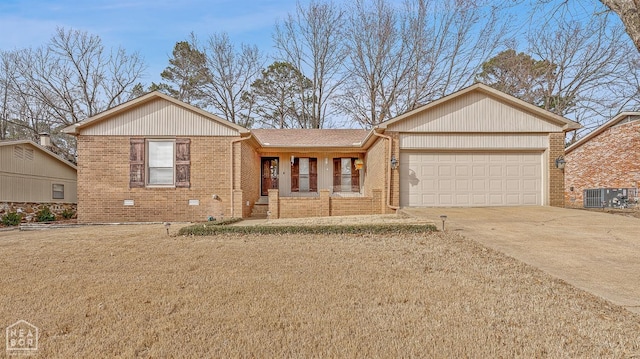 ranch-style house with central air condition unit, brick siding, an attached garage, and driveway