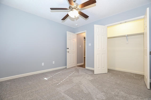 unfurnished bedroom featuring carpet, baseboards, a closet, and ceiling fan