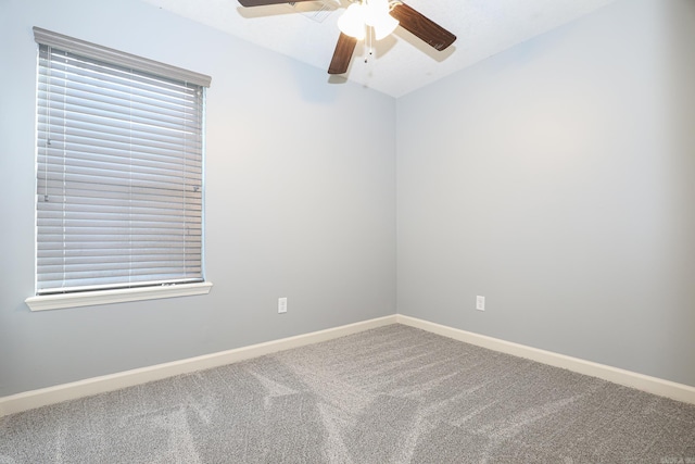 unfurnished room featuring baseboards, a ceiling fan, and carpet floors