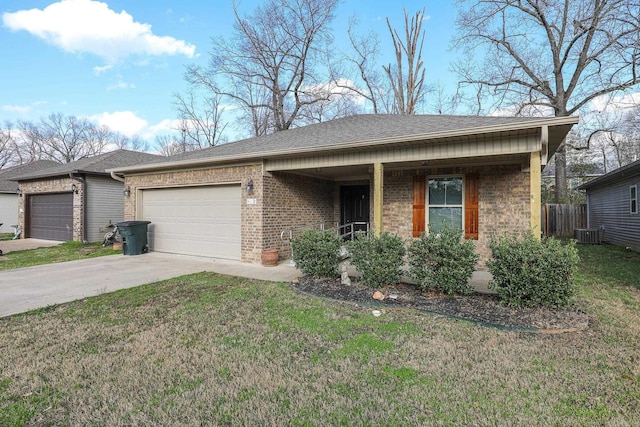 ranch-style home featuring concrete driveway, an attached garage, brick siding, and a front lawn