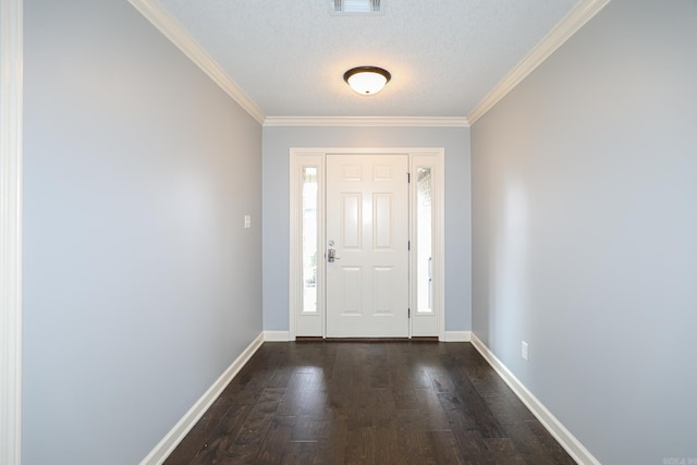 foyer entrance with a textured ceiling, dark wood-type flooring, baseboards, and ornamental molding