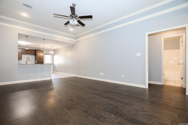 unfurnished living room featuring dark wood-style floors, ceiling fan with notable chandelier, visible vents, and baseboards