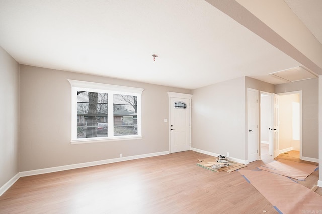 interior space with light wood-style flooring and baseboards