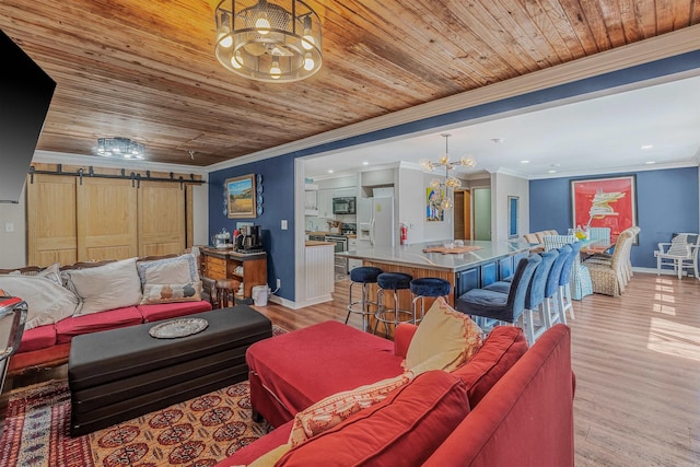 living room featuring a chandelier, wood ceiling, crown molding, and a barn door