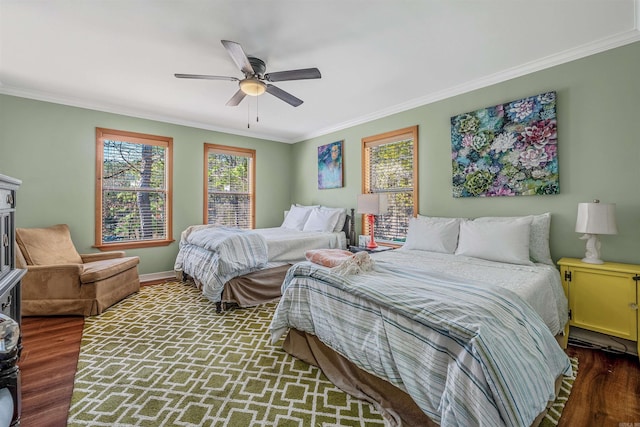 bedroom featuring multiple windows and ornamental molding