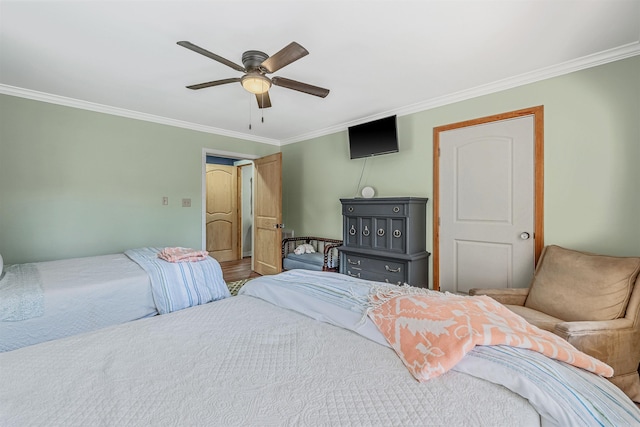 bedroom featuring a ceiling fan and ornamental molding