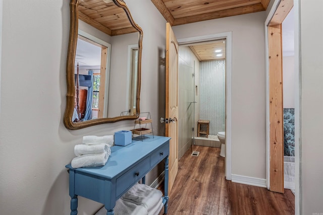 hall with wooden ceiling, wood finished floors, and baseboards