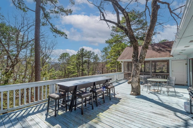 wooden deck with outdoor dining area