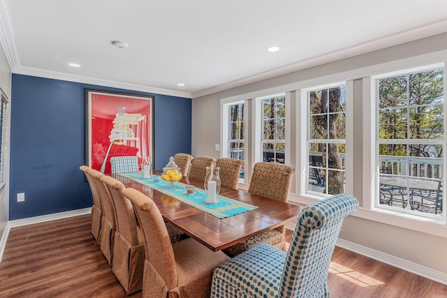 dining space with crown molding, recessed lighting, wood finished floors, and baseboards