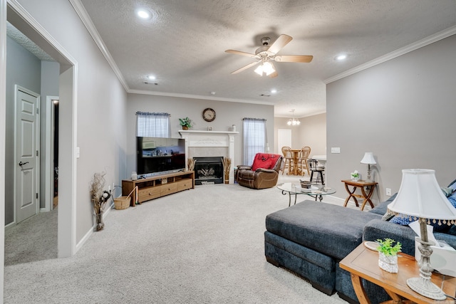 carpeted living area featuring crown molding, baseboards, a fireplace with flush hearth, ceiling fan with notable chandelier, and a textured ceiling