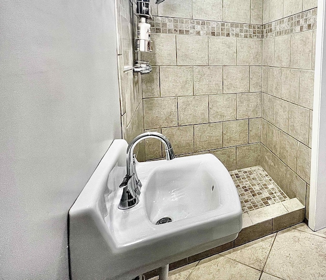 full bathroom with a shower stall and a sink