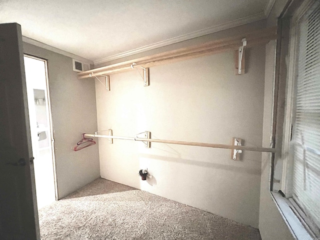 laundry room with visible vents and ornamental molding