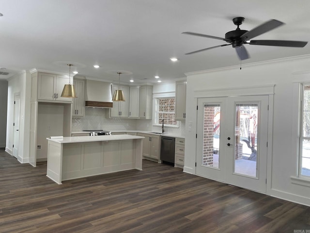 kitchen featuring premium range hood, a sink, a center island, french doors, and dishwashing machine