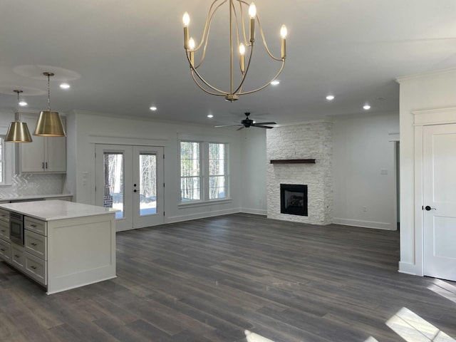 kitchen with tasteful backsplash, a center island, light countertops, ornamental molding, and recessed lighting