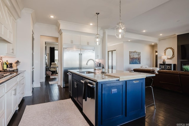 kitchen featuring white cabinetry, dark wood-type flooring, blue cabinetry, and open floor plan