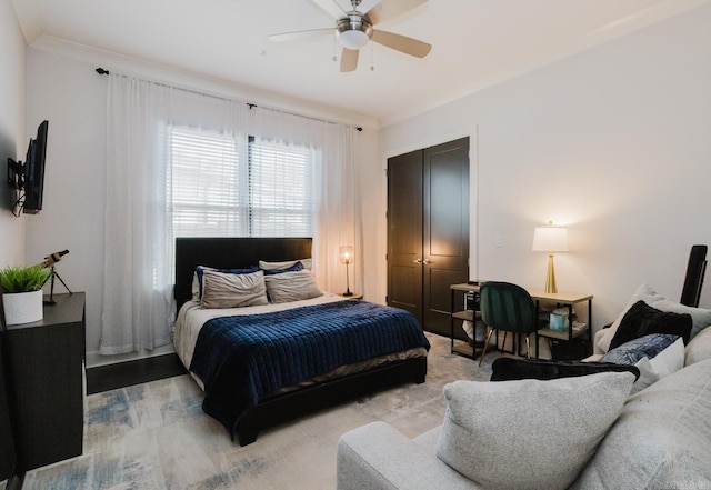 bedroom with ceiling fan and wood finished floors