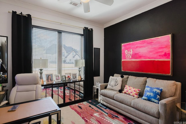 living area featuring visible vents and a ceiling fan