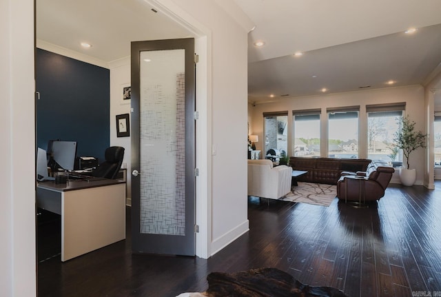 hallway featuring recessed lighting, wood finished floors, baseboards, and ornamental molding