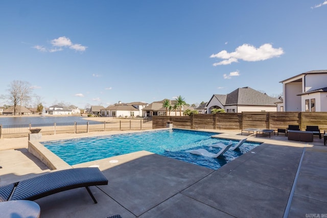 view of swimming pool with a fenced in pool, a patio area, a residential view, and a fenced backyard