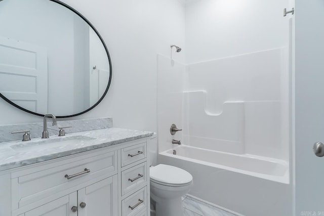 bathroom featuring toilet, vanity, and bathing tub / shower combination