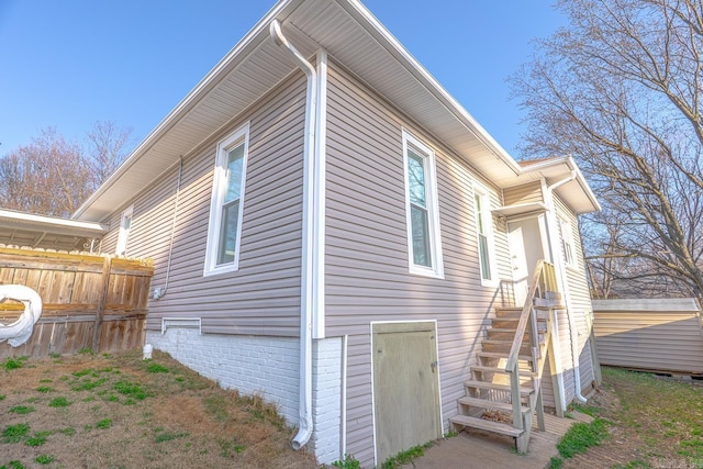 view of side of property with fence