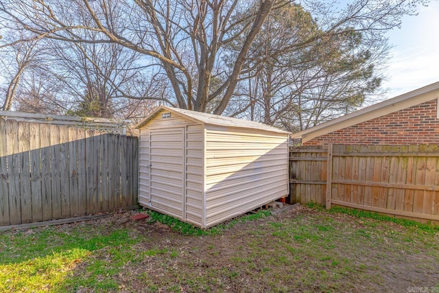 view of shed with a fenced backyard