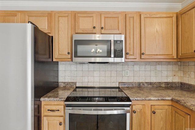 kitchen with dark countertops, tasteful backsplash, and appliances with stainless steel finishes