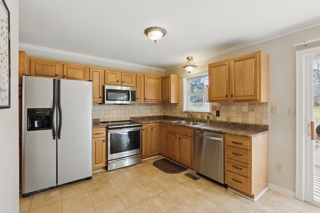 kitchen featuring a sink, decorative backsplash, dark countertops, and appliances with stainless steel finishes