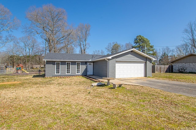 single story home featuring a playground, a front lawn, fence, concrete driveway, and an attached garage