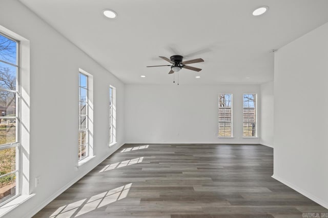 empty room featuring recessed lighting, a wealth of natural light, wood finished floors, and ceiling fan