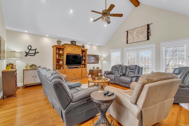 living room with a ceiling fan, high vaulted ceiling, light wood-style flooring, recessed lighting, and beamed ceiling