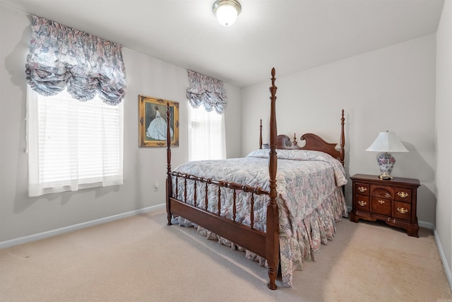 bedroom featuring carpet flooring and baseboards