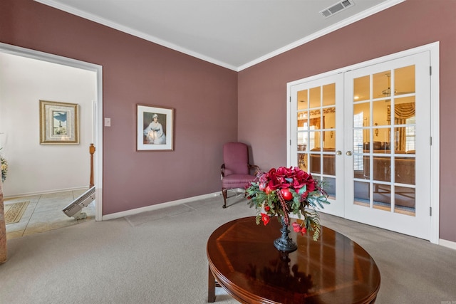 sitting room featuring visible vents, baseboards, carpet, ornamental molding, and french doors