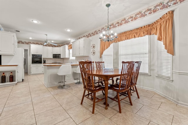 dining area featuring visible vents, ceiling fan with notable chandelier, recessed lighting, light tile patterned flooring, and baseboards