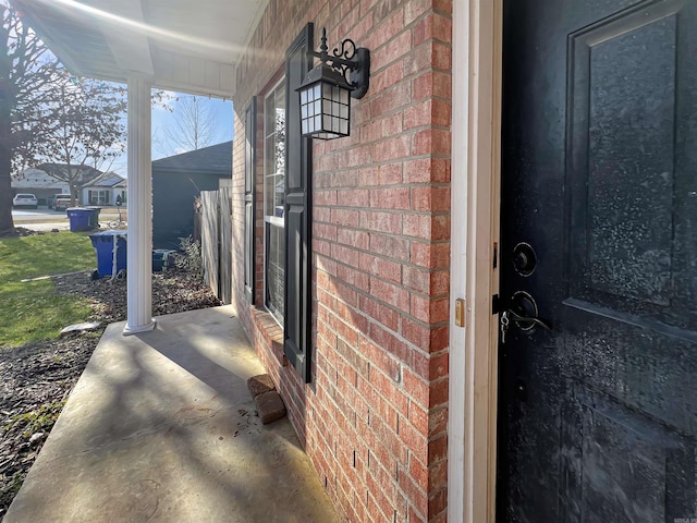 exterior space featuring brick siding