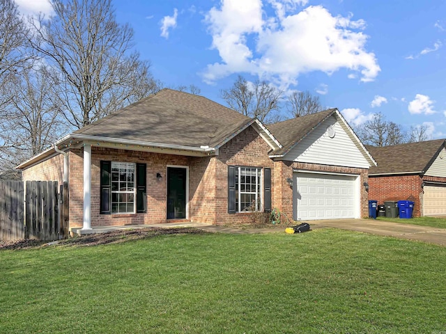 single story home with fence, concrete driveway, a front yard, a garage, and brick siding