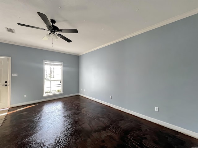 spare room featuring visible vents, ornamental molding, concrete floors, baseboards, and ceiling fan