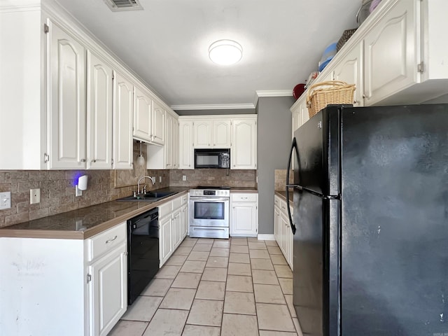 kitchen with black appliances, a sink, white cabinetry, tile countertops, and decorative backsplash