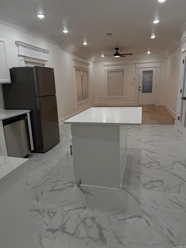 kitchen featuring marble finish floor, dishwasher, ornamental molding, and a ceiling fan