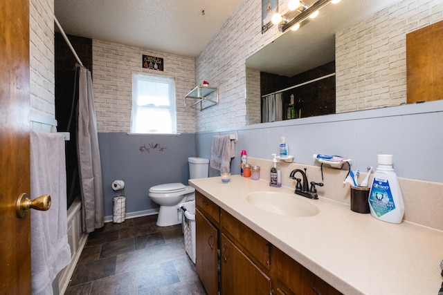 bathroom featuring vanity, brick wall, a textured ceiling, toilet, and shower / tub combo with curtain