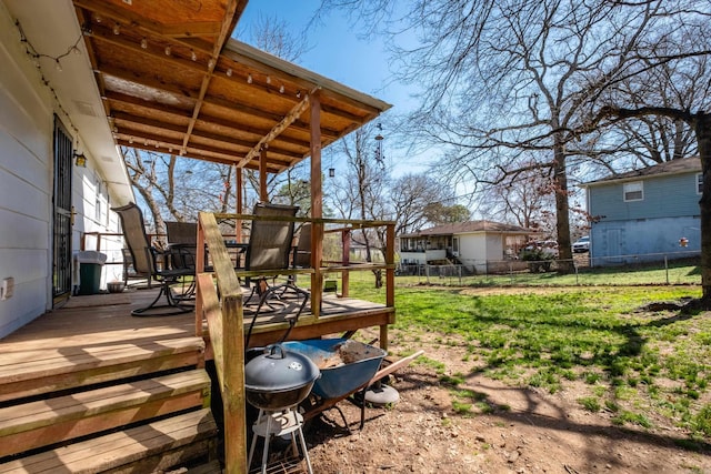 view of yard featuring fence and a wooden deck