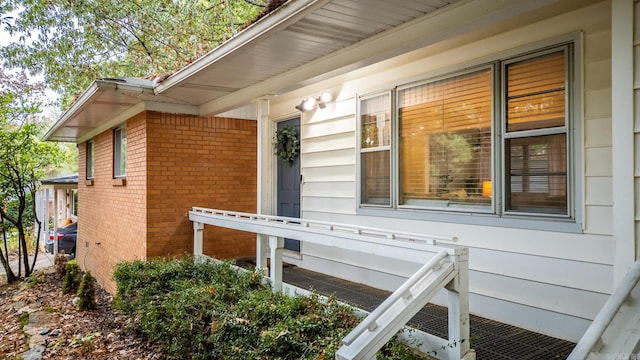 exterior space with brick siding