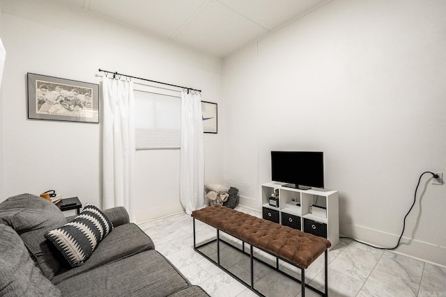 living room with marble finish floor and baseboards