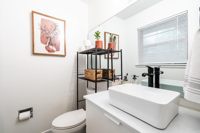 half bath with a sink and toilet